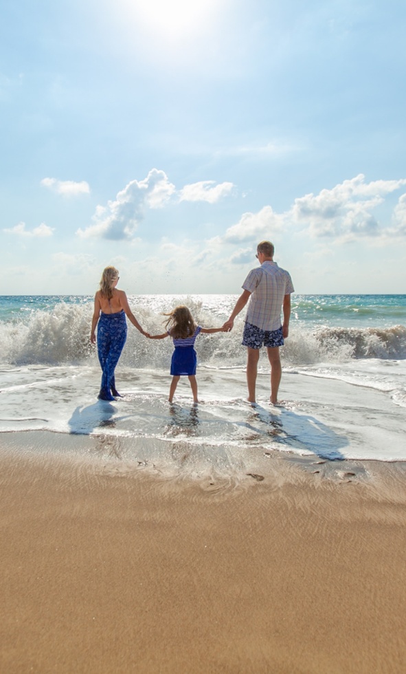 Family with a kid on beach